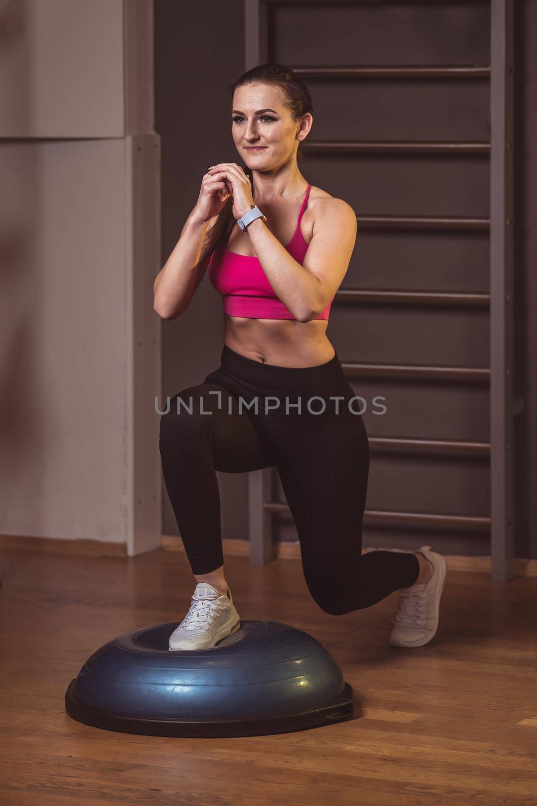lunge on a balance mat during fitness exercise.