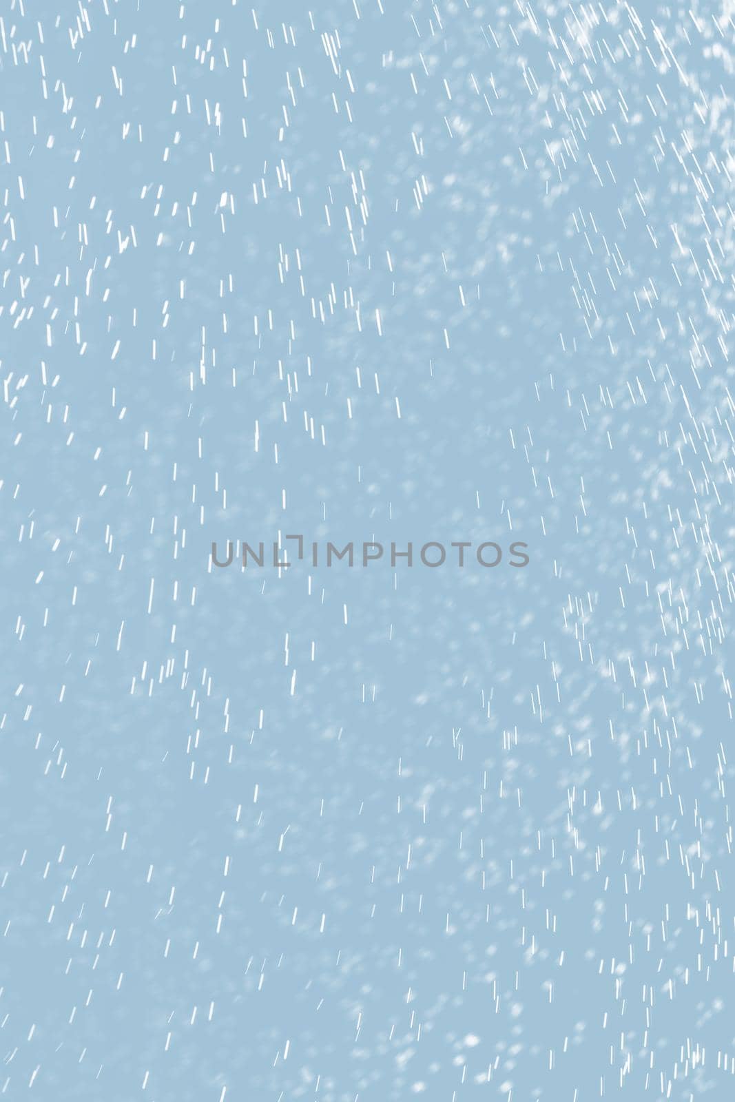 Abstract background of raindrops in light blue tonality