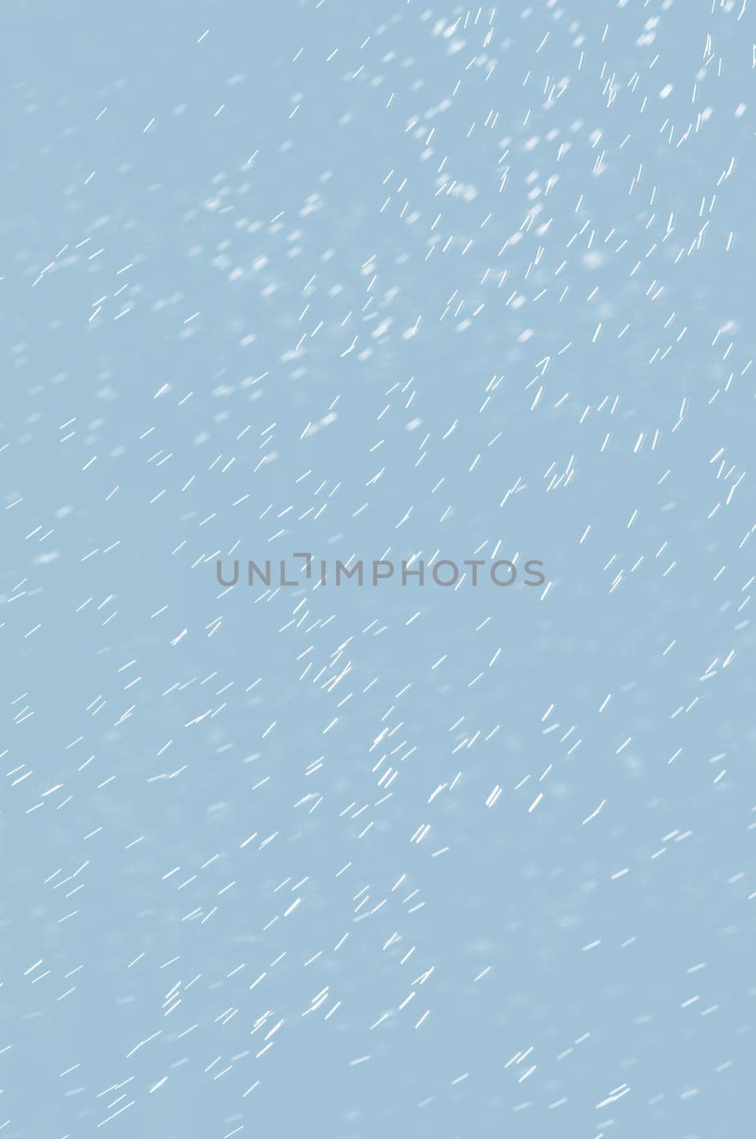 Abstract background of raindrops in light blue tonality
