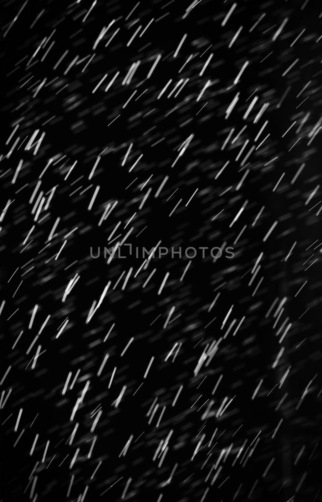 Rain on black. Abstract splashes of water on a black background for screen blending mode and photo retouching.