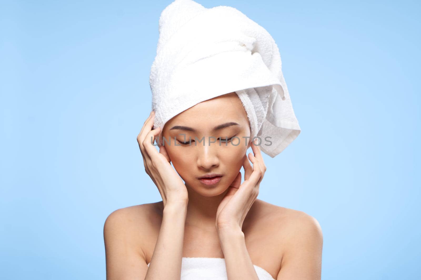 pretty asian woman with towel on head after shower clean skin. High quality photo