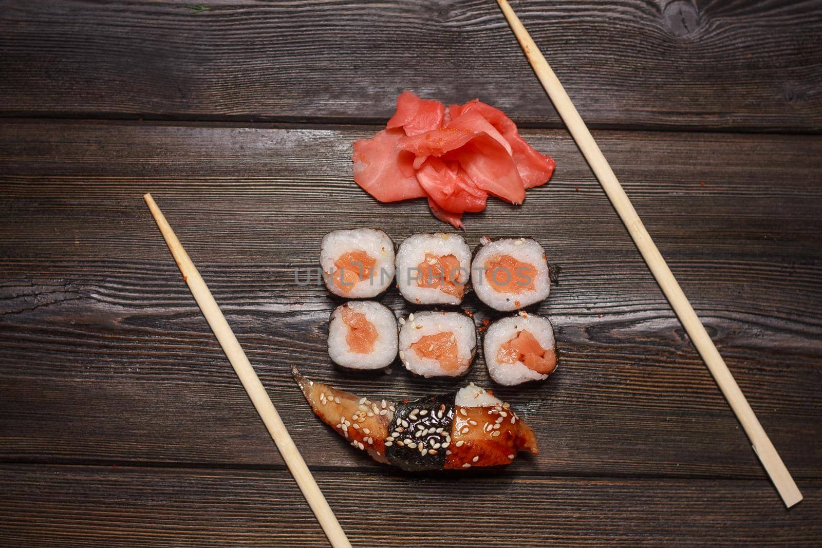 asian food sushi and roll set wooden sticks seafood. High quality photo