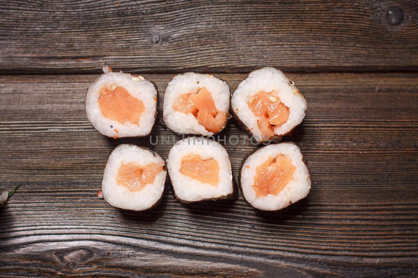 with sushi chopsticks ginger delicacy wooden background meal. High quality photo
