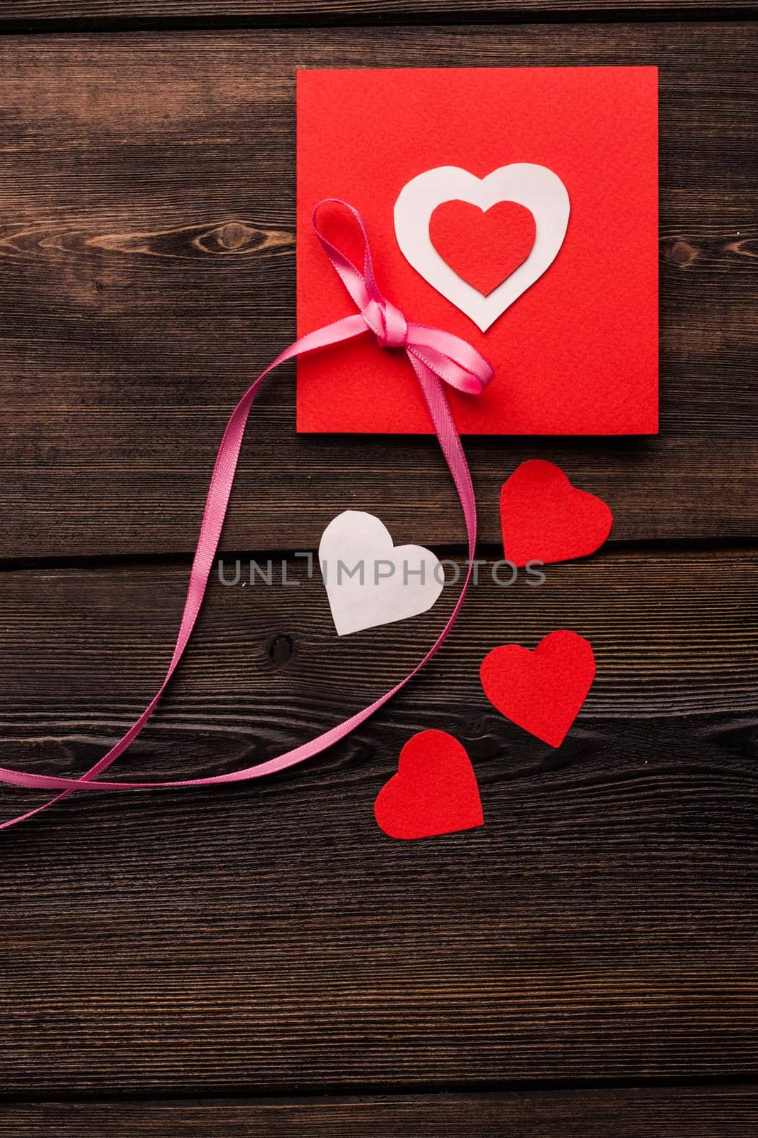 greeting card with heart holiday gift valentines day decoration wooden background by SHOTPRIME