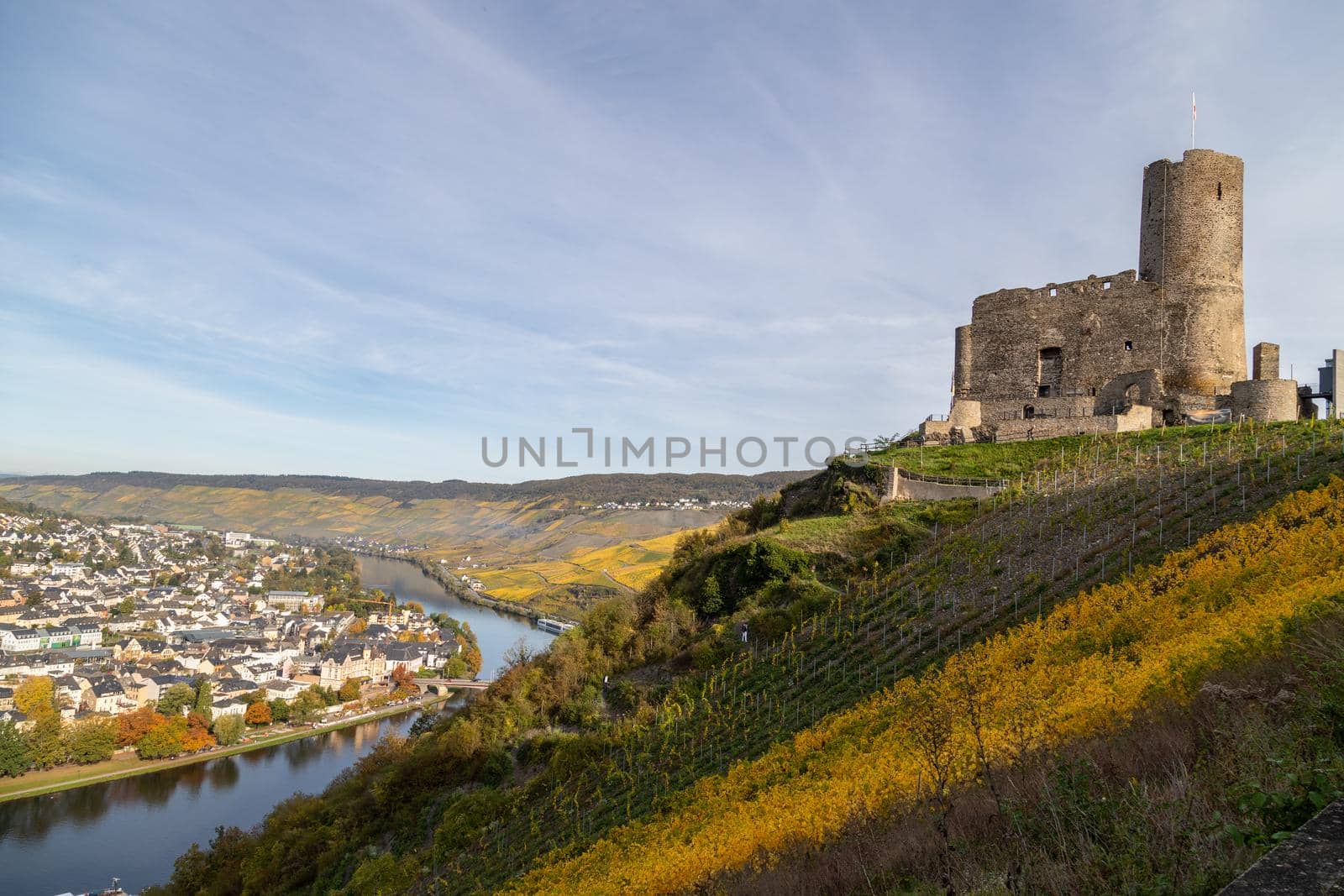 Scenic view at Landshut castle in Bernkastel-Kues on the river Moselle in autumn with multi colored vineyards 