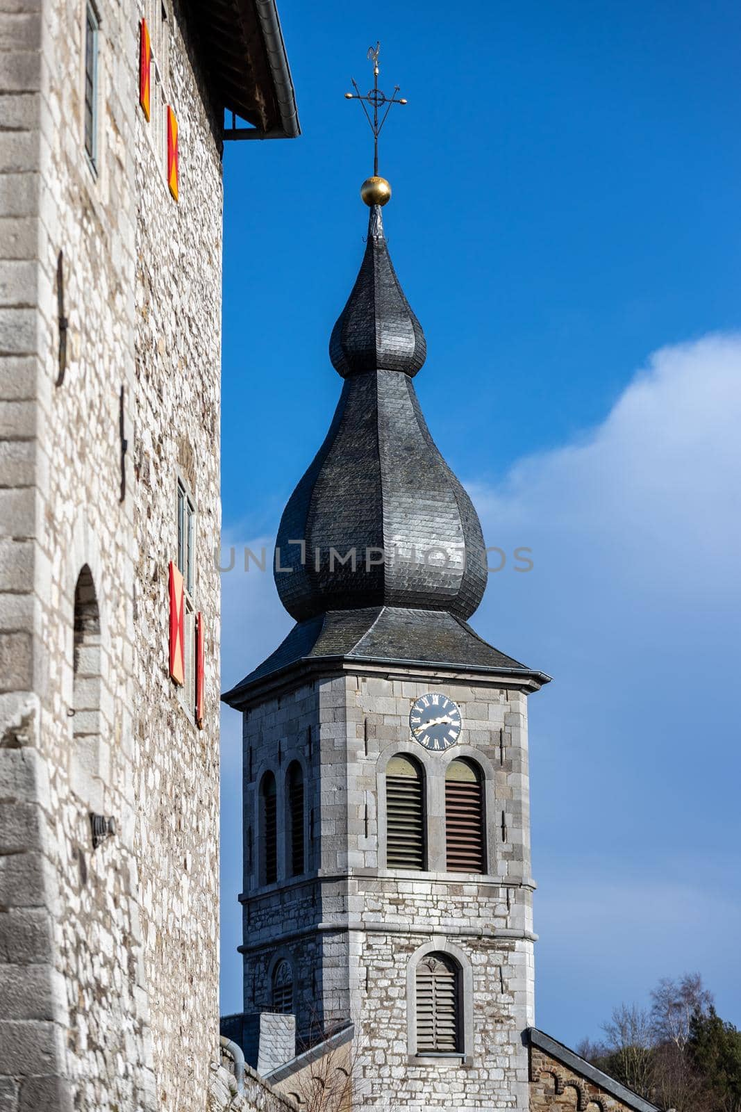 Low angle view at the tower of church Saint Lucia in Stolberg, Eifel, Germany