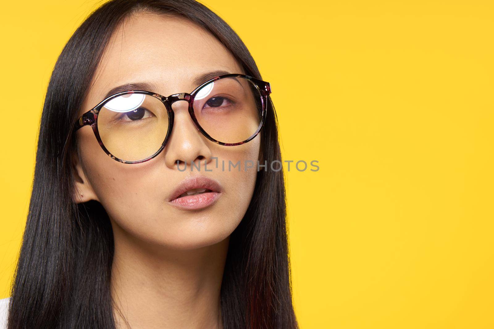 Business woman asian appearance glasses elegant style yellow background by SHOTPRIME