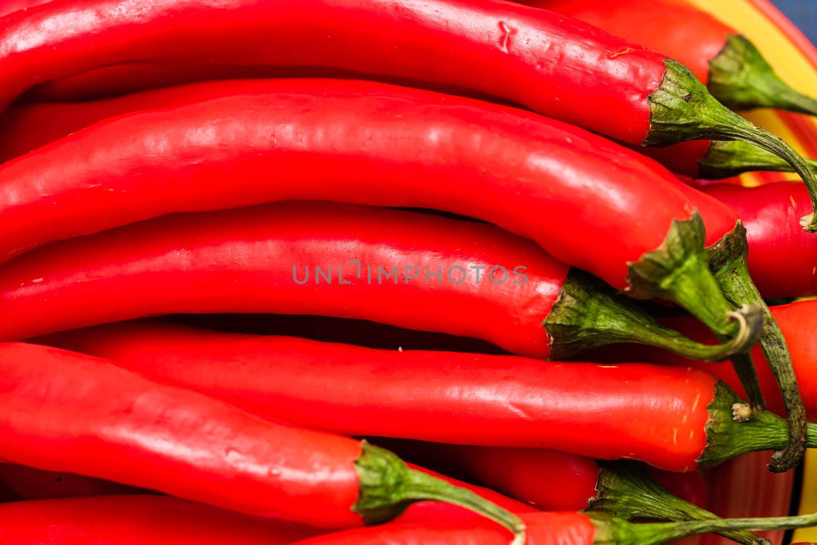 Red hot chilli peppers, close up. Background of red chilies