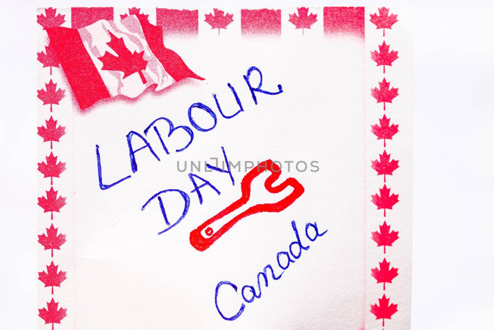 Labour day Canada handwriting on paper with Canada flag. Writing text on memo post reminder. Bucharest, Romania, 2020.