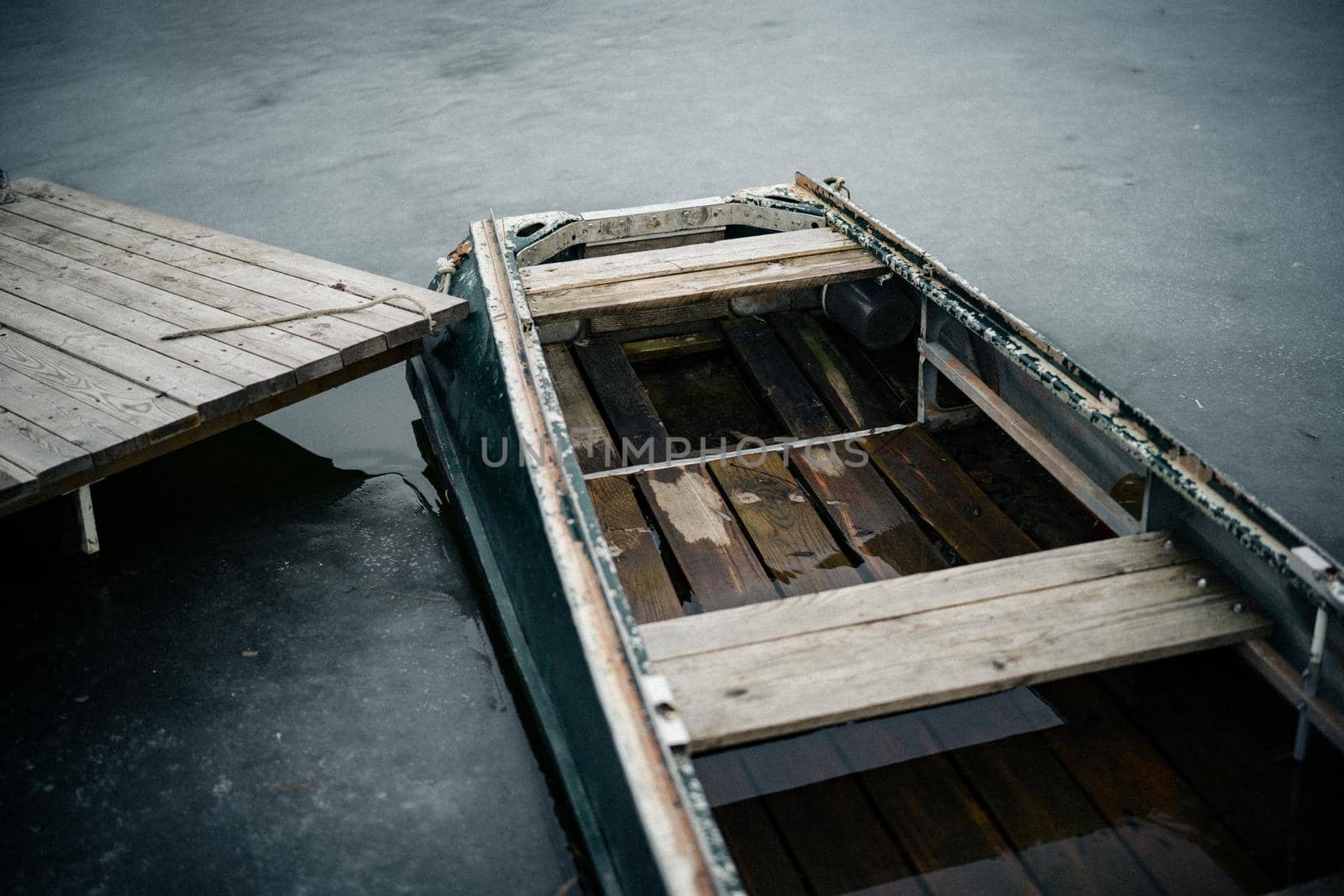 wooden boat near the pier on the nature in the river by SHOTPRIME