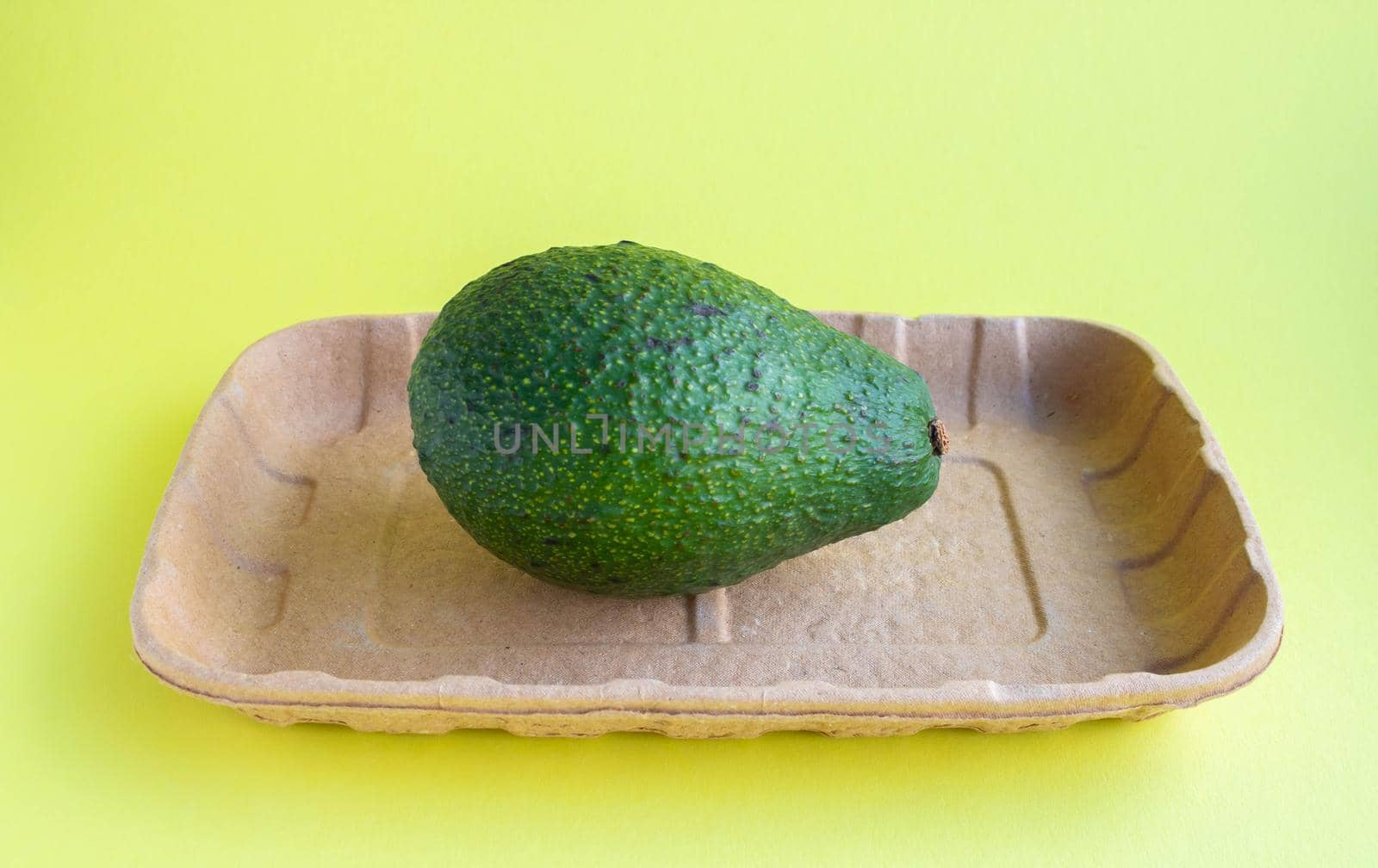 Avocado close-up on eco-backing . Natural fresh organic exotic fruits. Healthy food, raw food. Vegetarian lifestyle. Proper nutrition. Eco-friendly product.