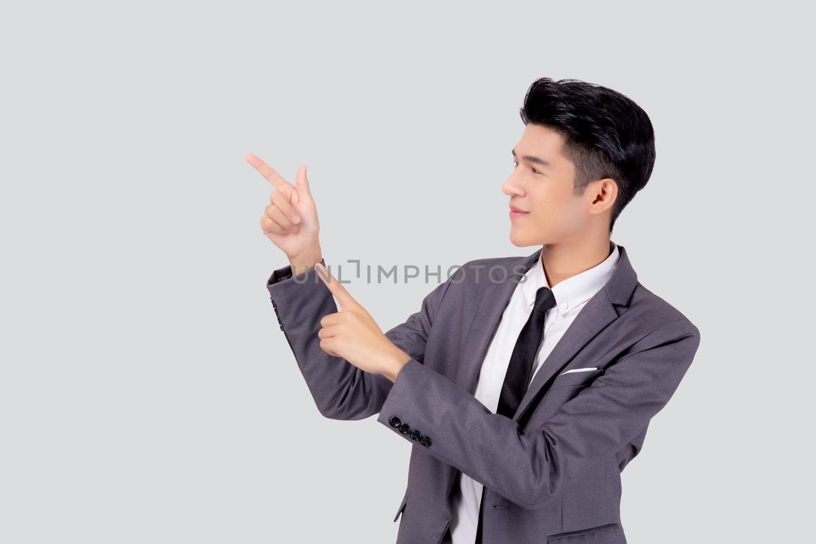 Portrait young asian business man pointing and presenting isolated on white background, advertising and marketing, executive and manager, male confident showing success, expression and emotion.