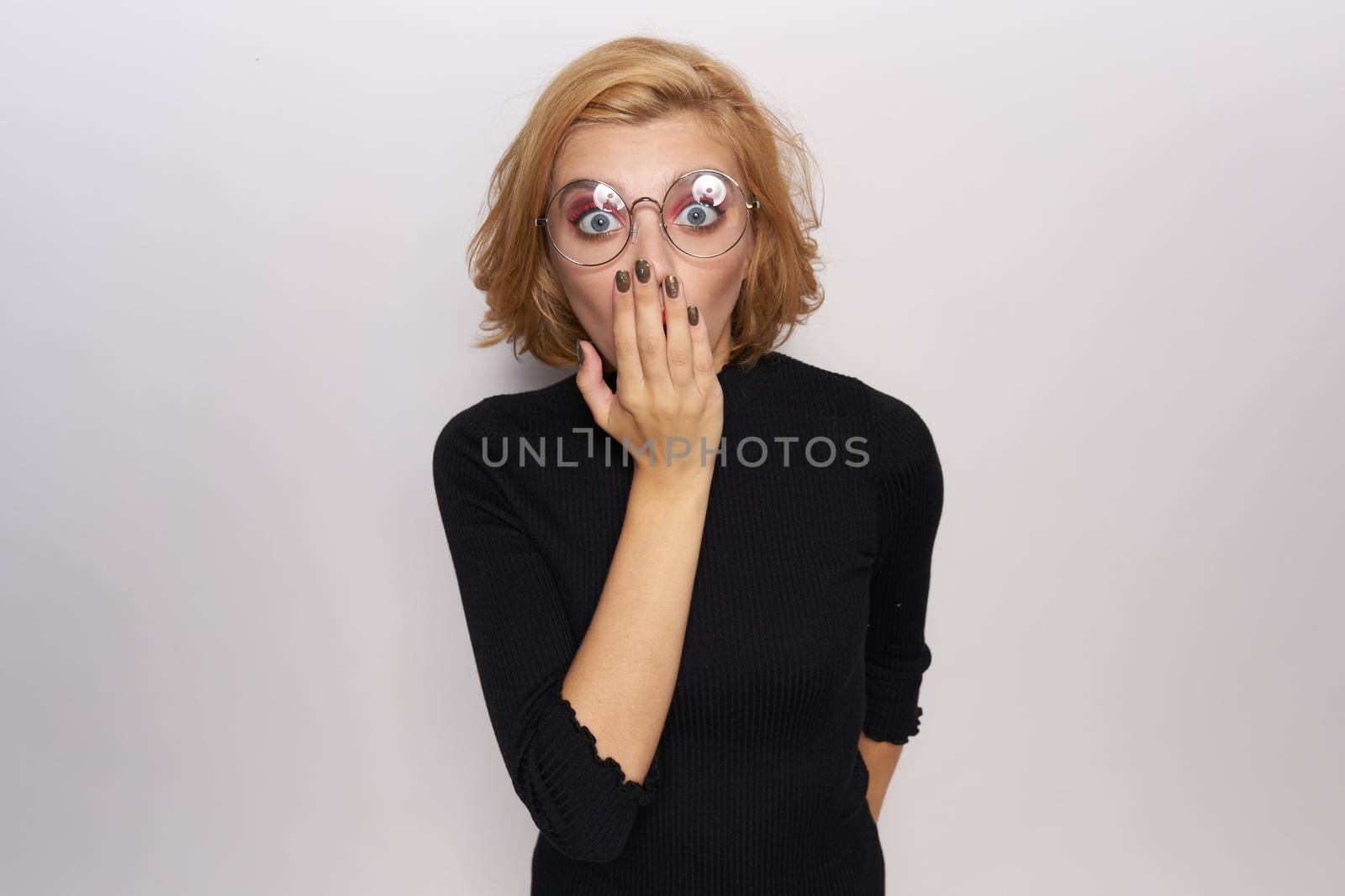 Beautiful blonde in glasses fashionable clothes emotions lifestyle light background by SHOTPRIME