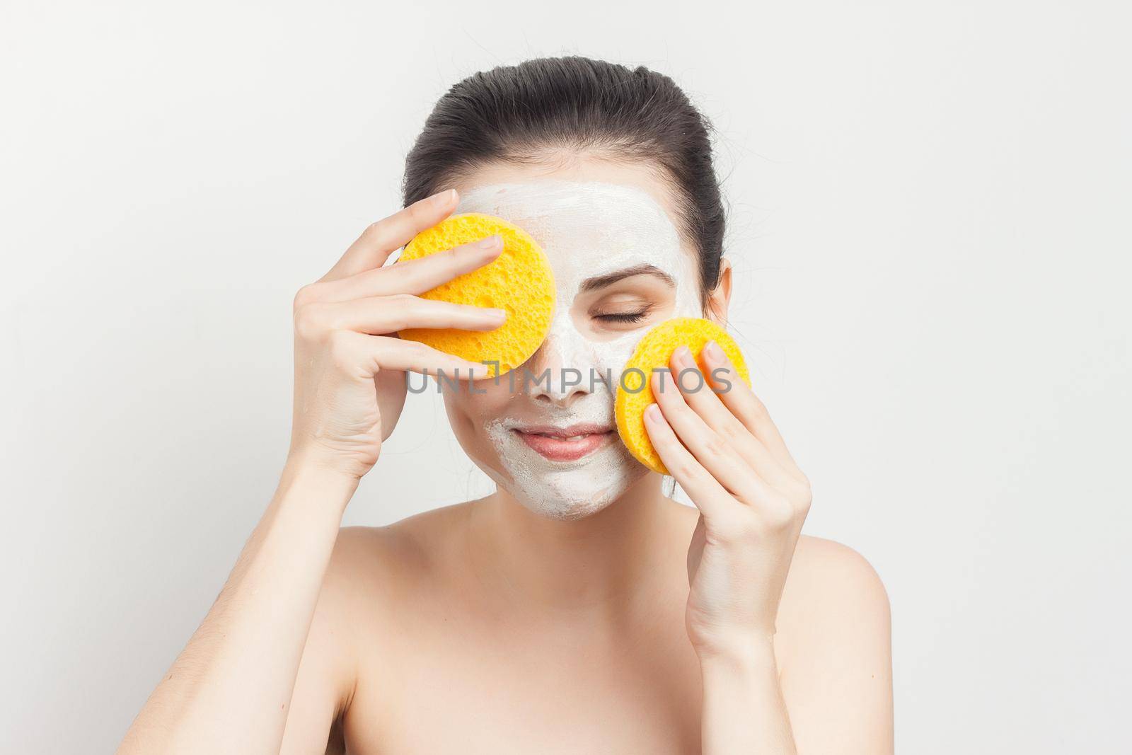 woman naked shoulders face cream skin care cosmetology close-up. High quality photo