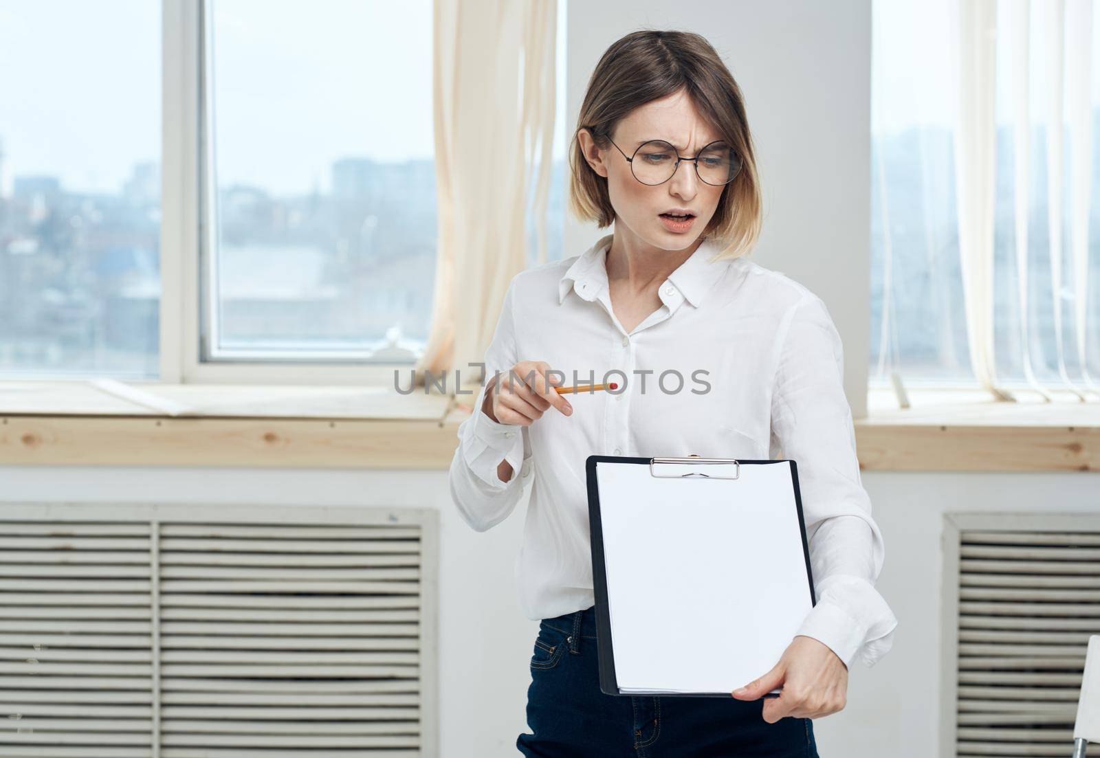 white sheet of paper mockup Woman rooming near window interior Folder . High quality photo