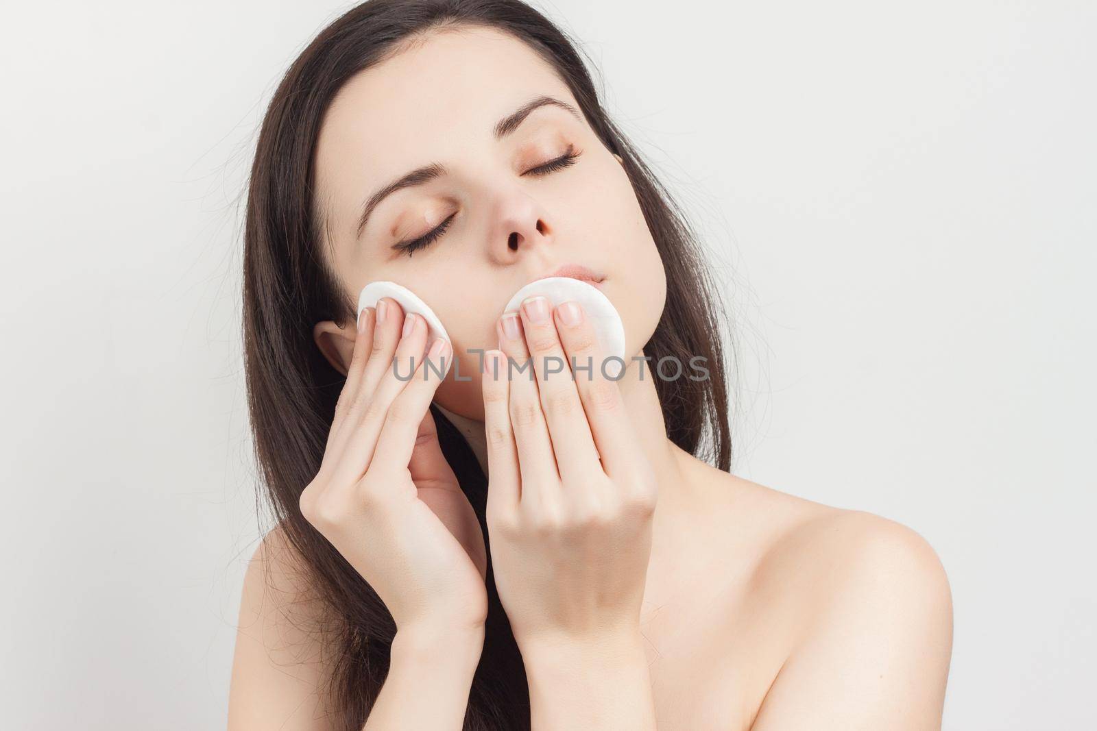 brunette bare shoulders cosmetics skincare cropped view. High quality photo
