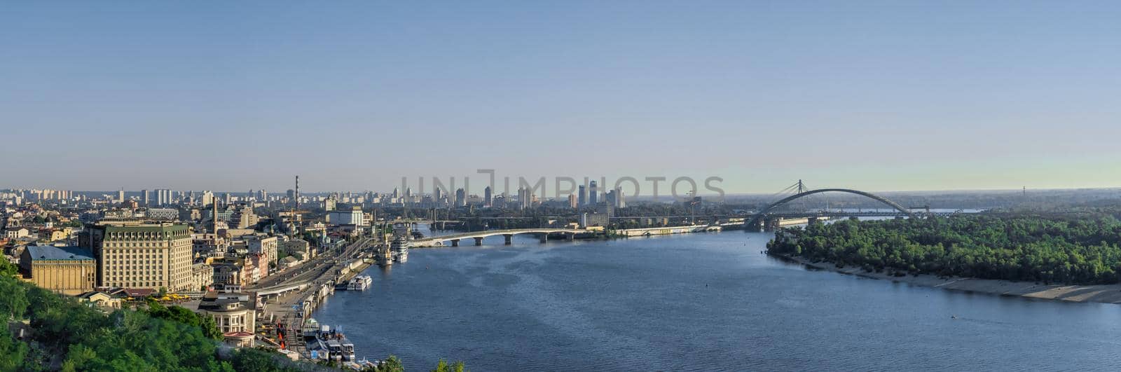 Kyiv, Ukraine 07.11.2020. View of the Dnieper River and the city of Kiev, Ukraine, from the pedestrian bridge on a sunny summer morning