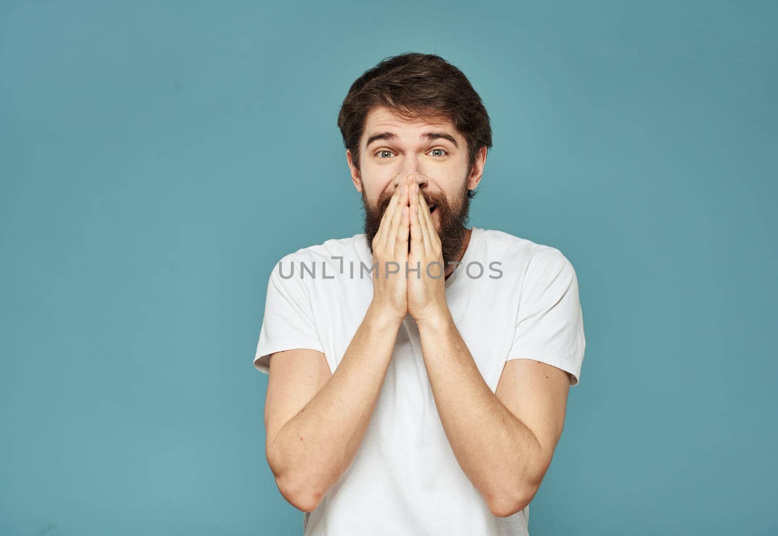 portrait of an enthusiastic man On a blue background cropped view Copy Space. High quality photo