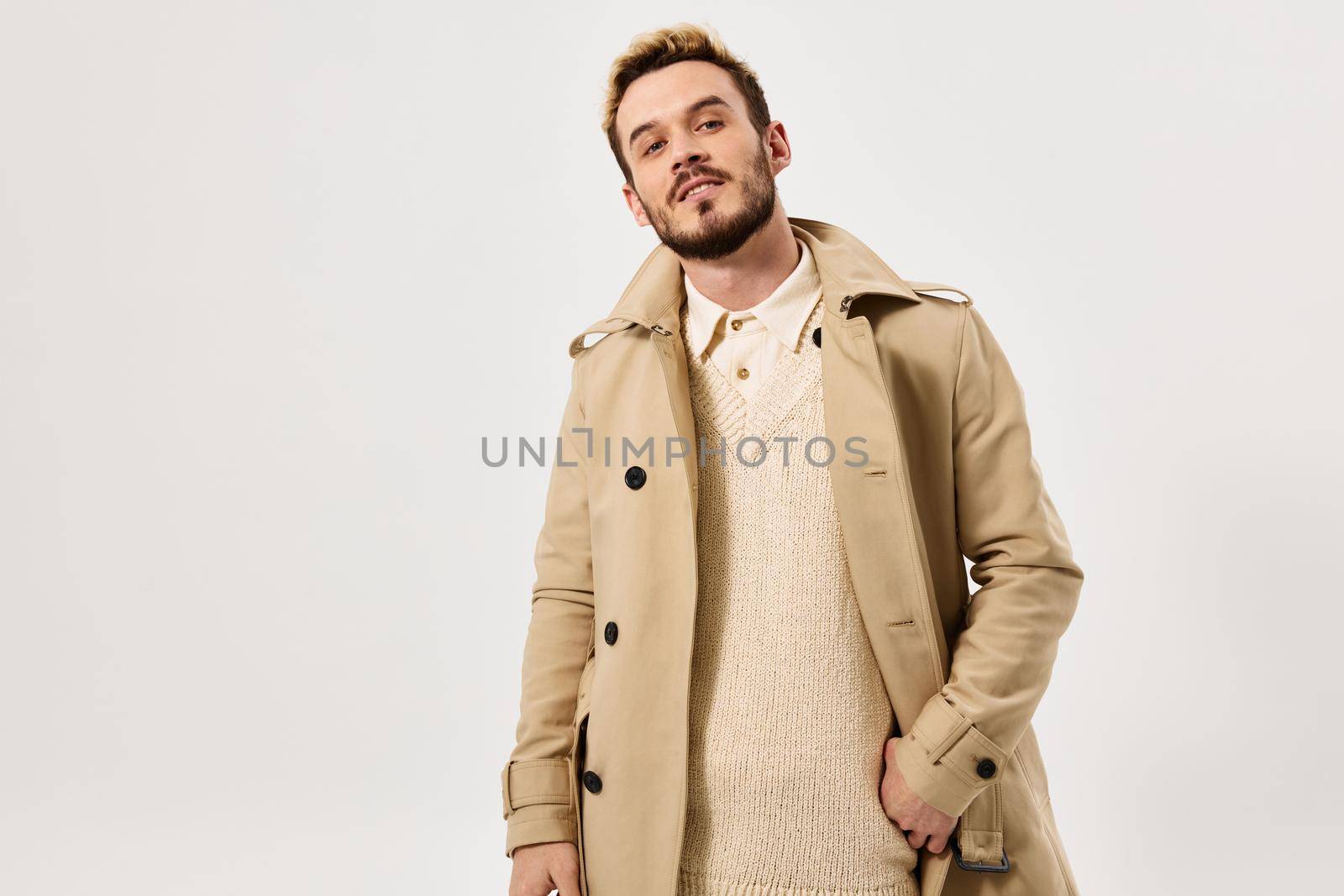 man in beige coat fashionable hairstyle attractive look Studio by SHOTPRIME