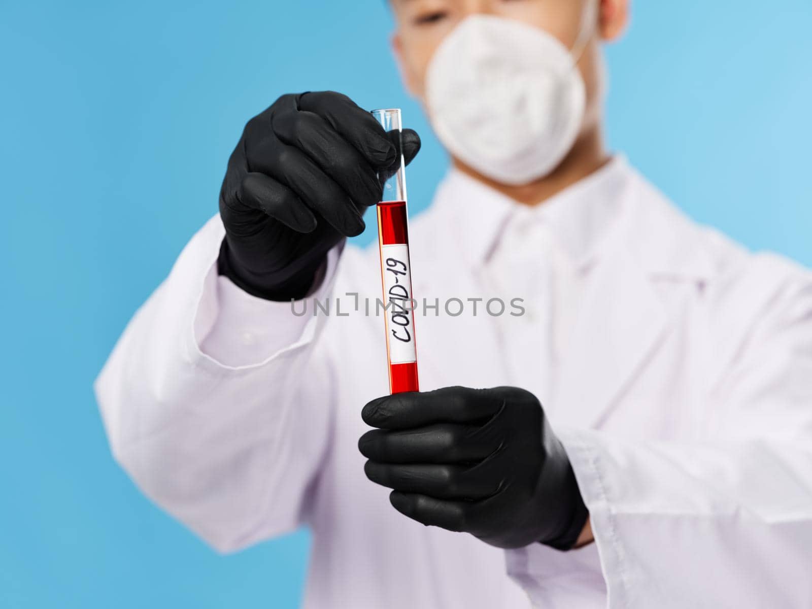 Male Asian appearance laboratory diagnostics black gloves. High quality photo