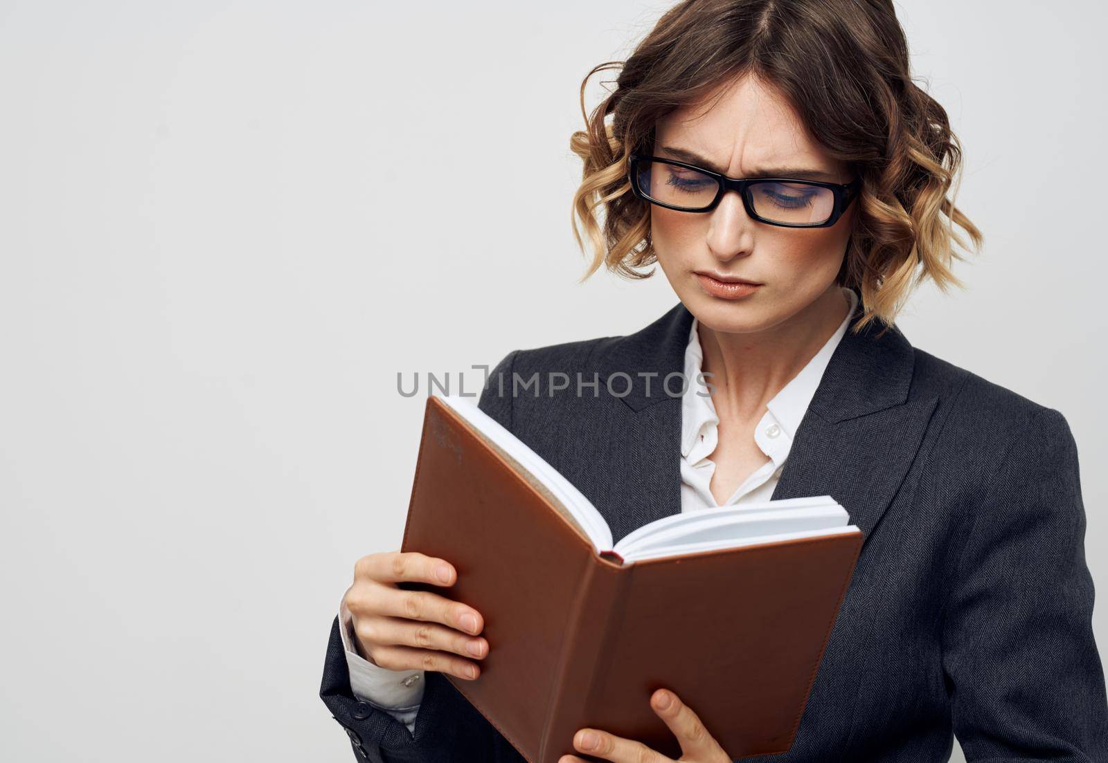 Business woman classic suit book bound finance model. High quality photo