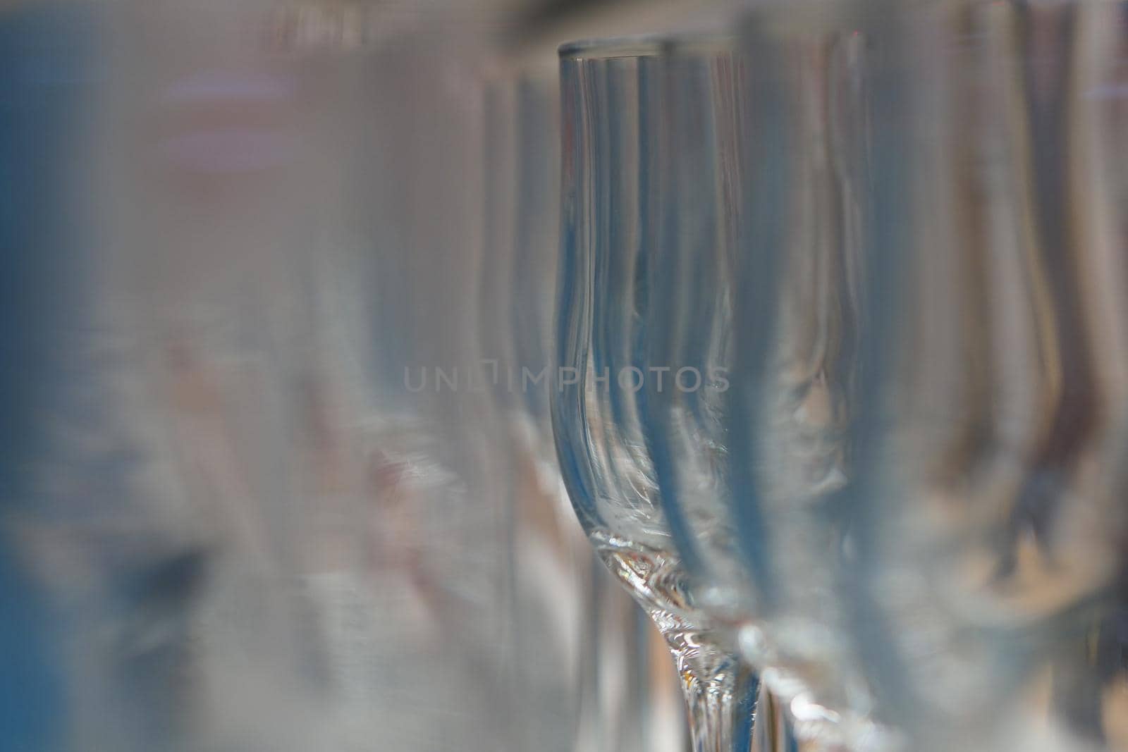 Empty glass wine glass on blurry background. Side. by Olga26