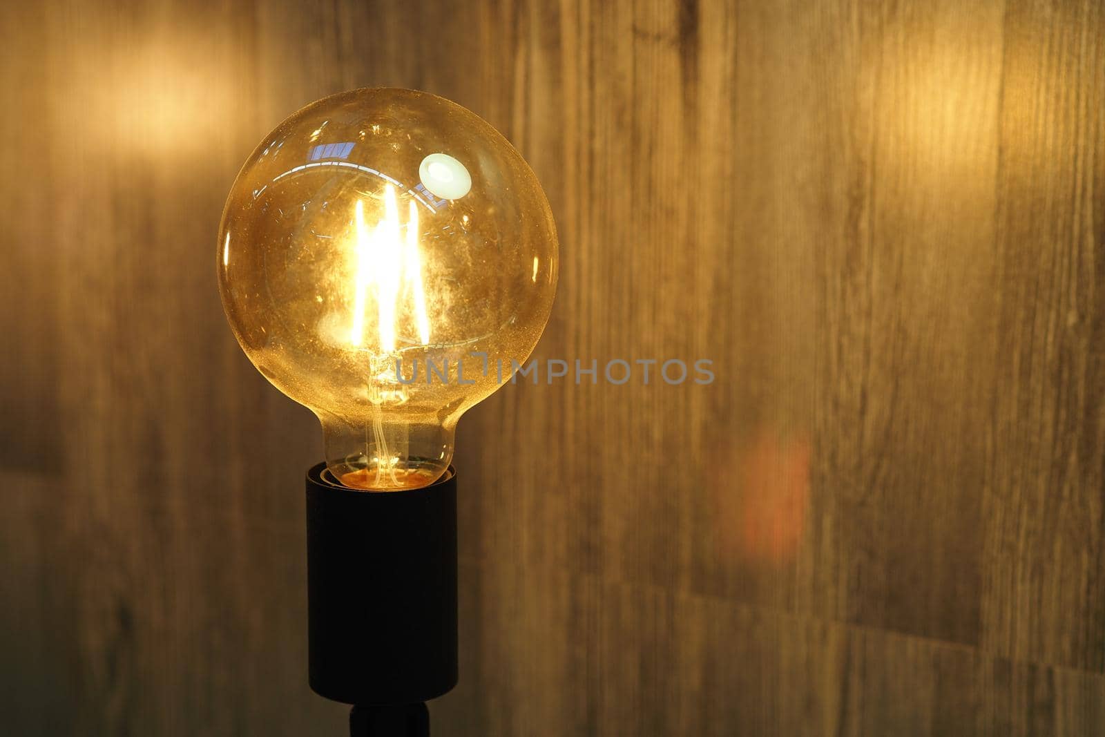 Vintage lamp. An ancient decorative lamp with a yellow lamp. High quality photo