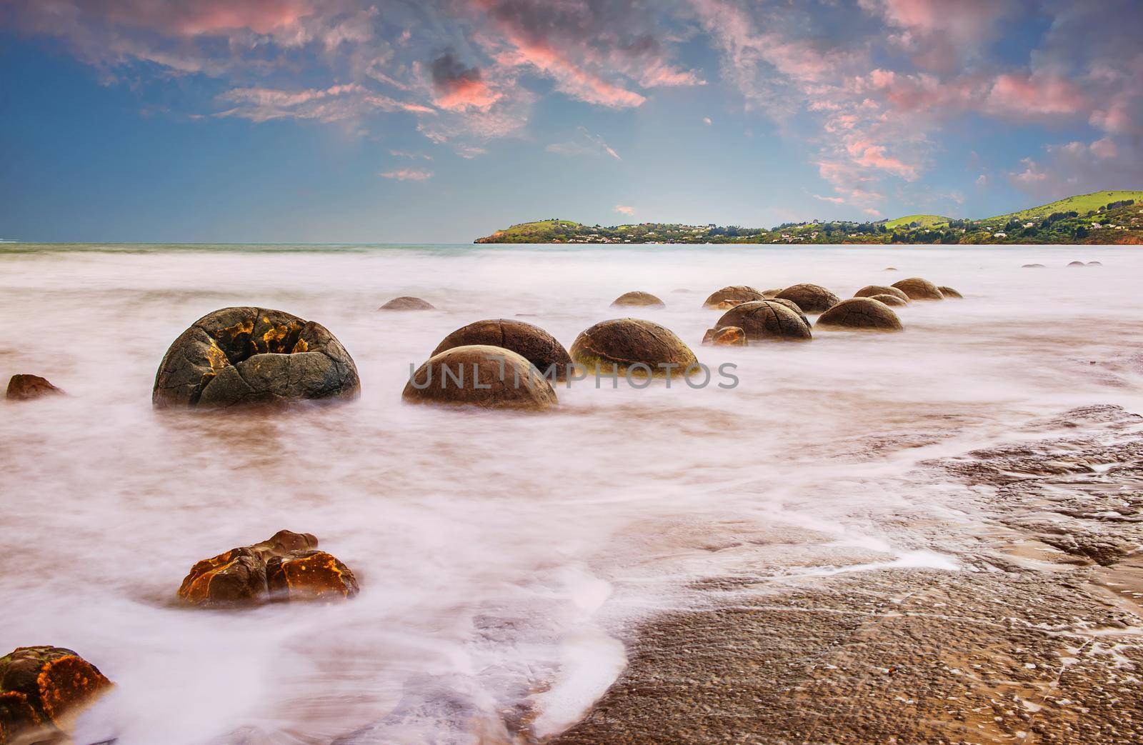 Sunset over Moeraki boulders in the New Zealand by fyletto