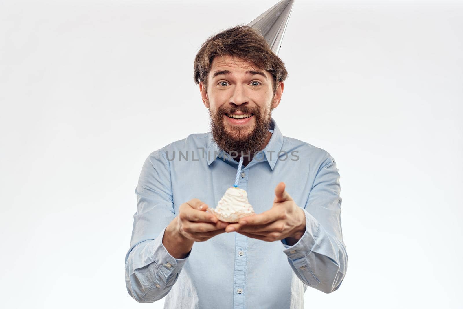Happy guy with birthday cake white background Compact corporate party cropped beard view. High quality photo