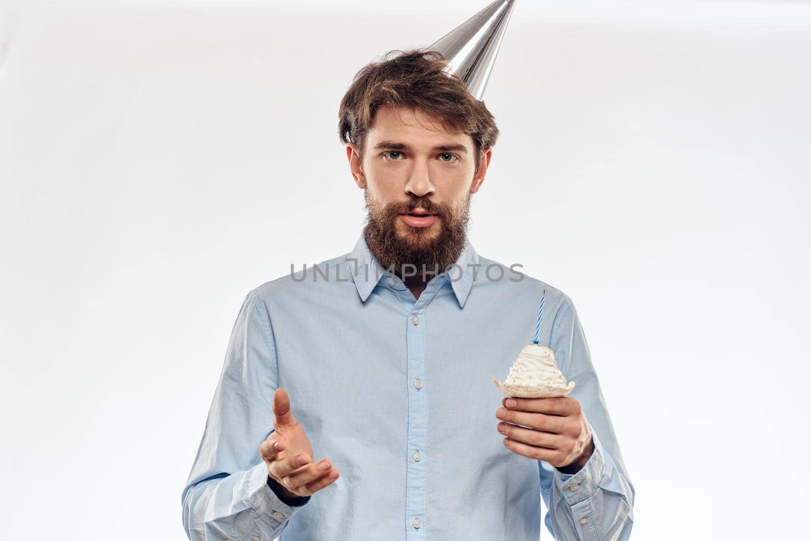 Happy guy with birthday cake white background Compact corporate party cropped beard view. High quality photo