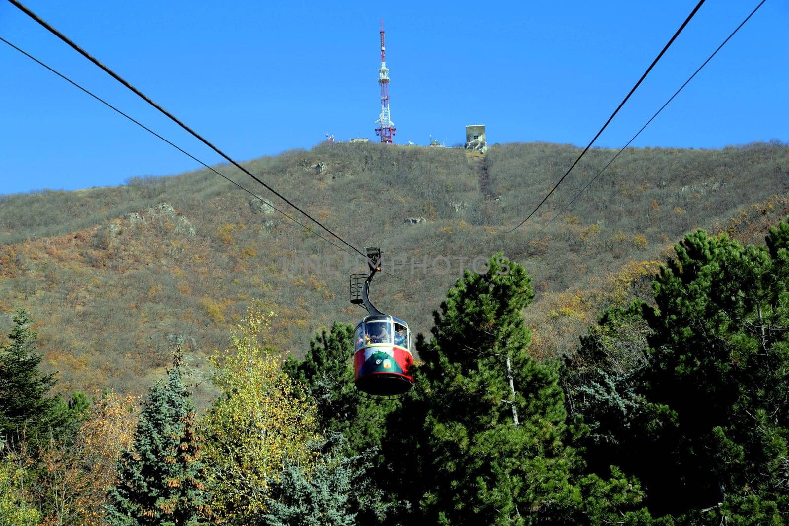 Journey to the mountains in a red wagon by cable car