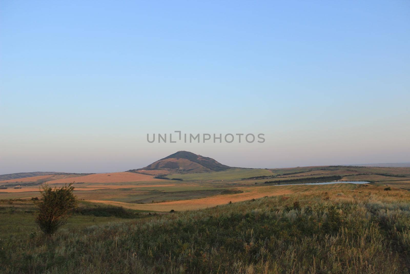 Summer natural landscape with mountains in the background.