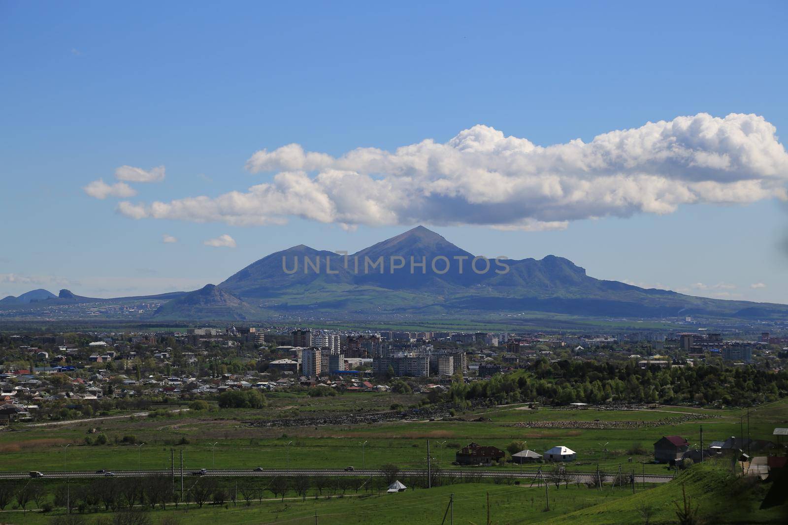 Beautiful natural landscape with green vegetation and mountains in the background.