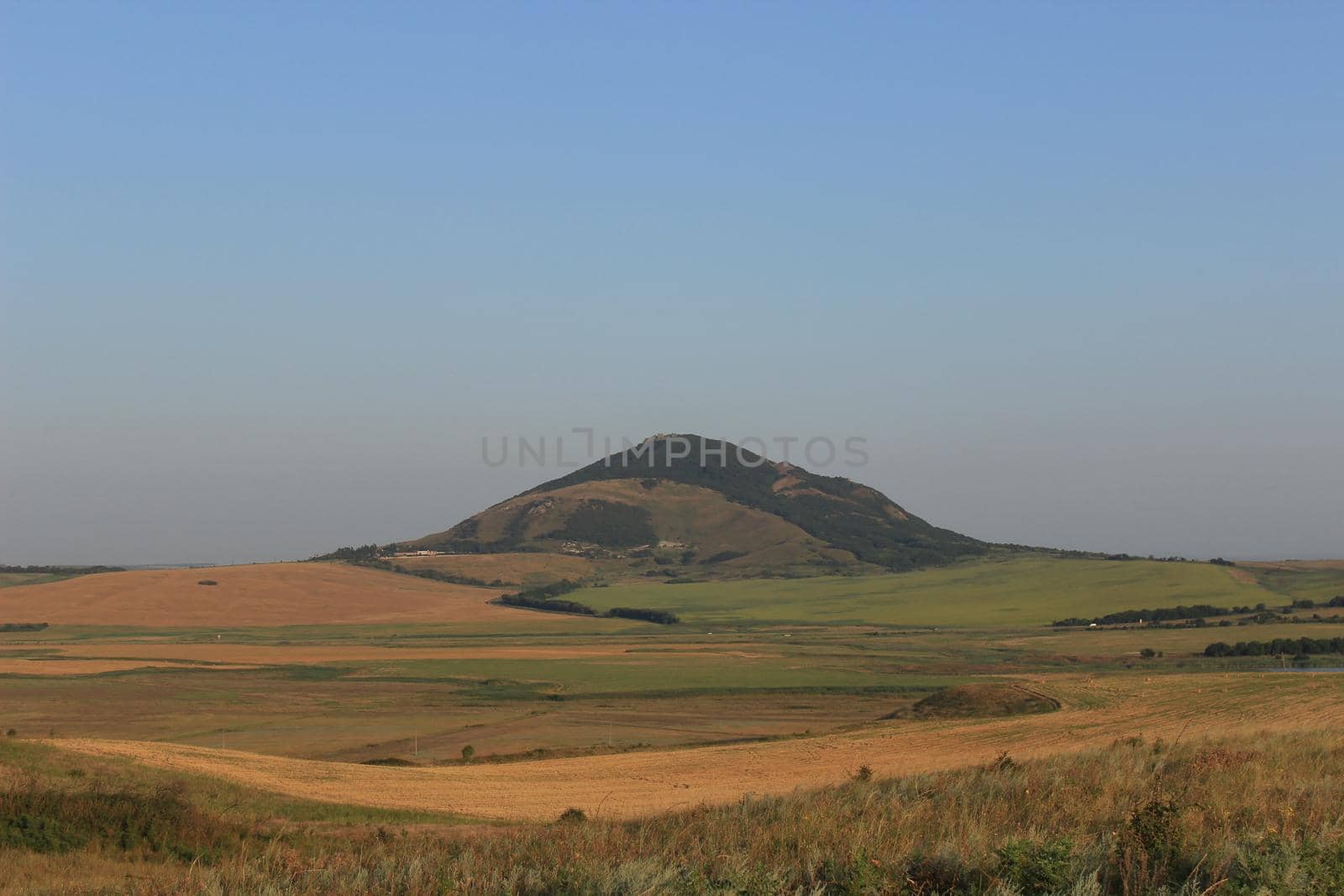 Summer natural landscape with mountains in the background.