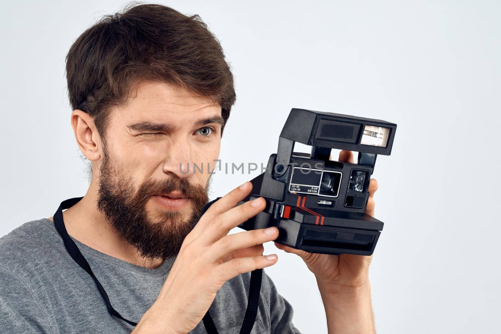 Male photographer holding a professional camera tasty technology hobby. High quality photo