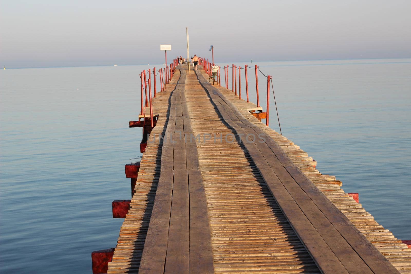 A wooden bridge at sea. Seascape. by Olga26