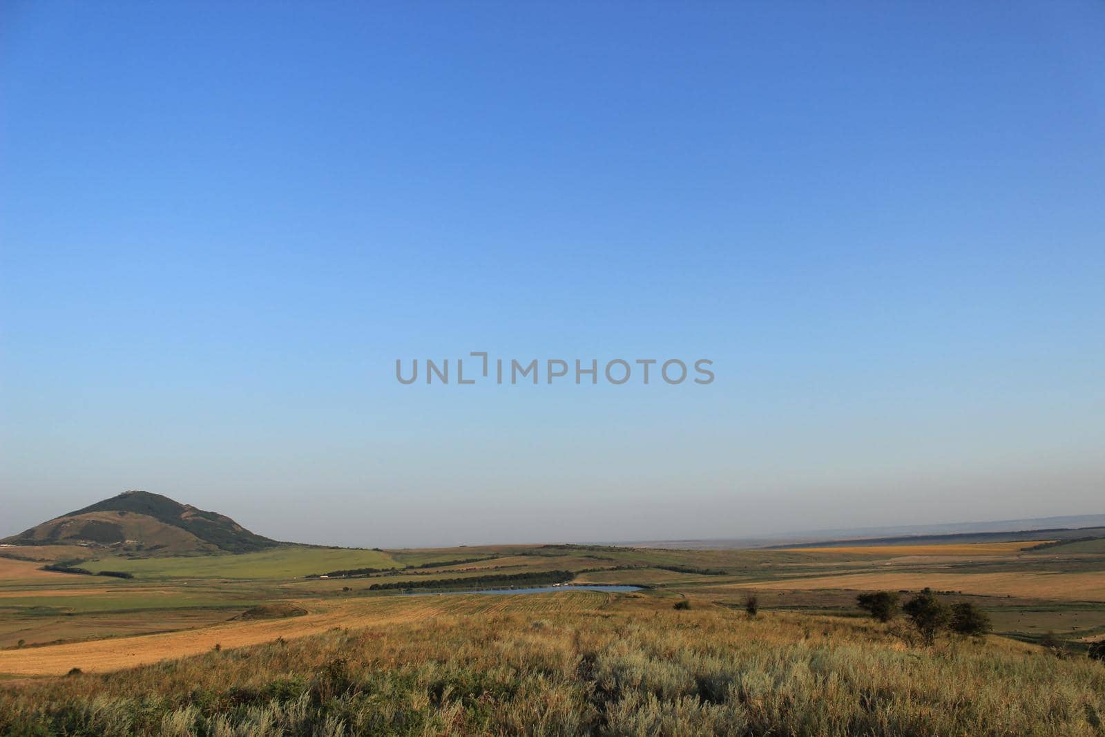 A natural landscape with mountains in the background. by Olga26