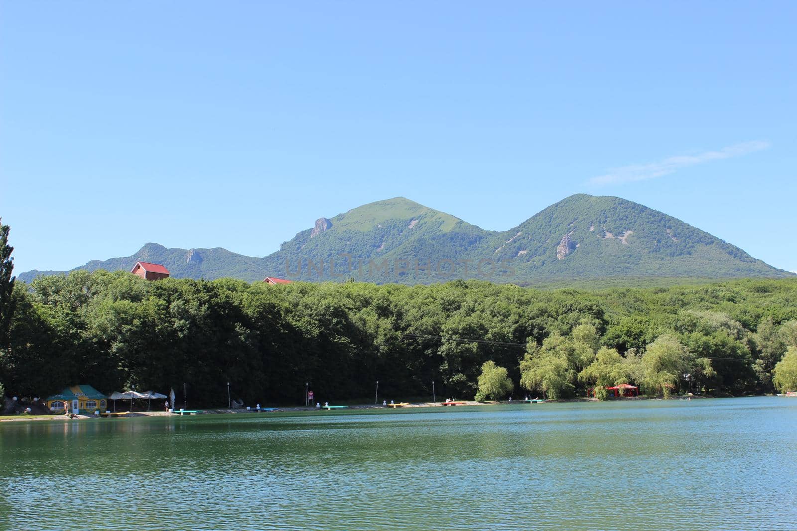 Decorative lake in the park near the mountain.