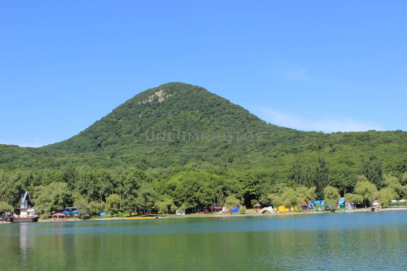 Decorative lake in the park near the mountain.