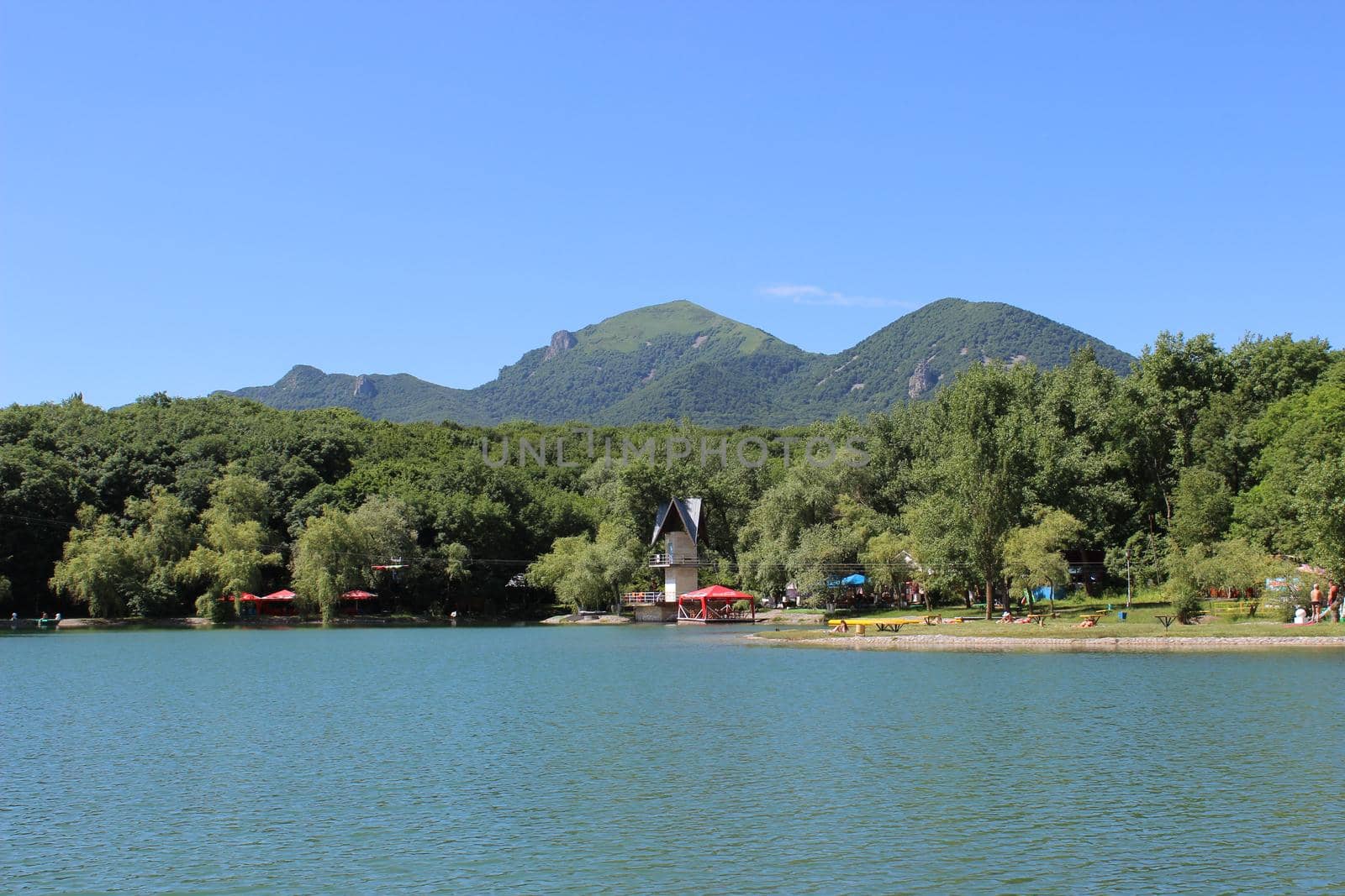 Decorative lake in the park near the mountain.