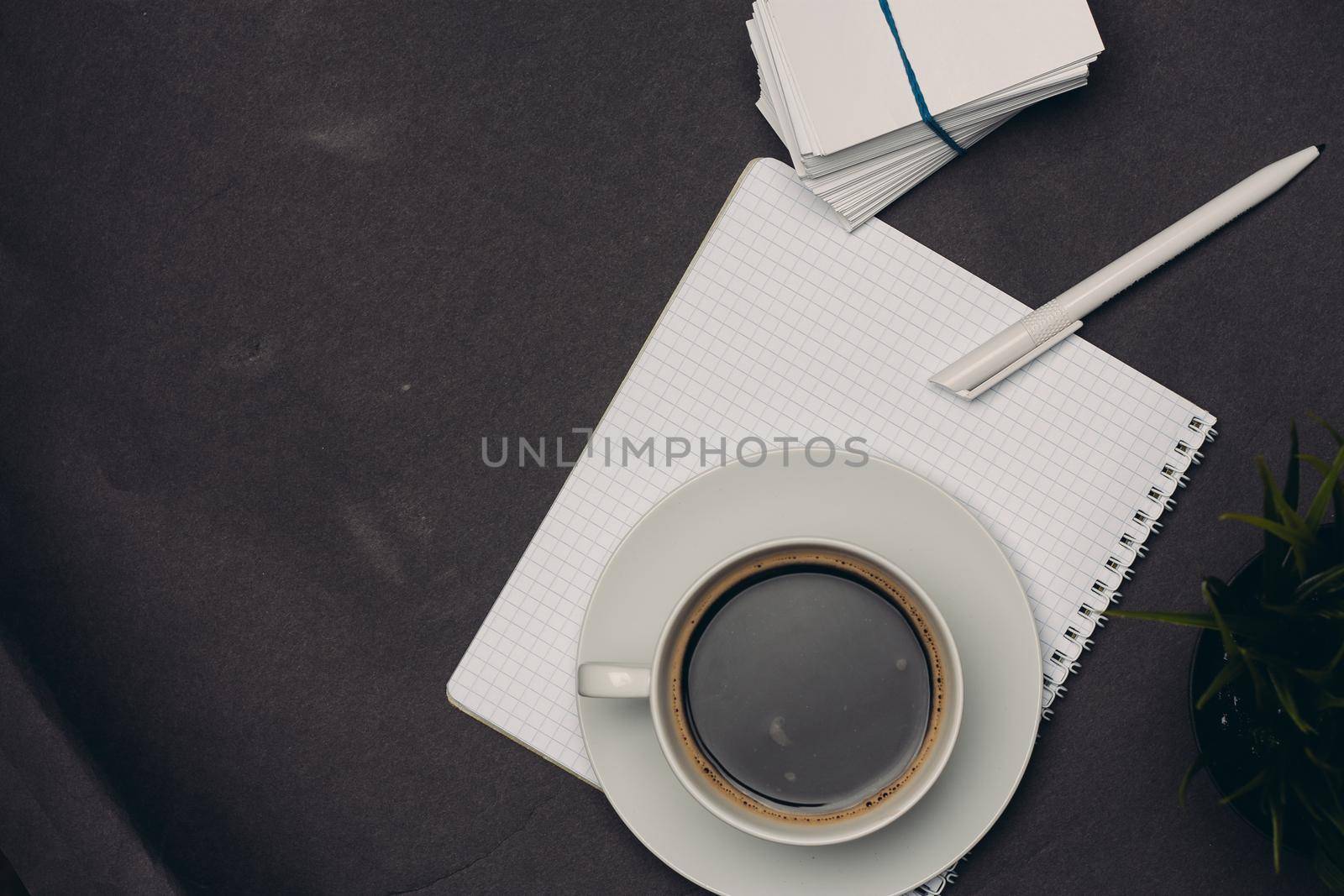 coffee cup desktop business card pen office close-up. High quality photo