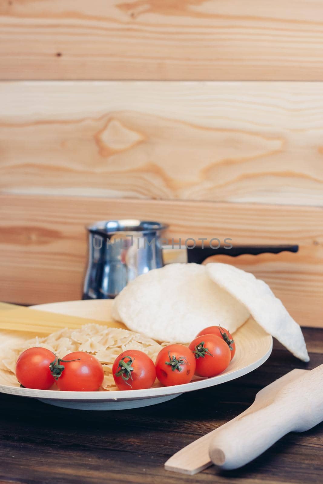 Italian pasta cherry tomatoes ingredients for cooking. High quality photo