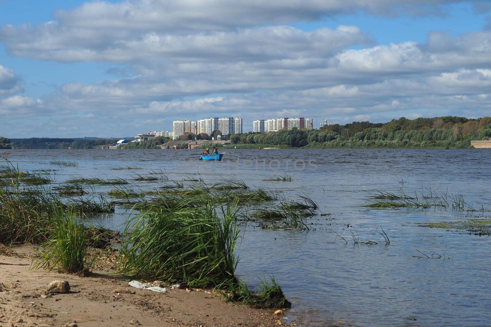 River sand mining. A wide river, a view from the shore.