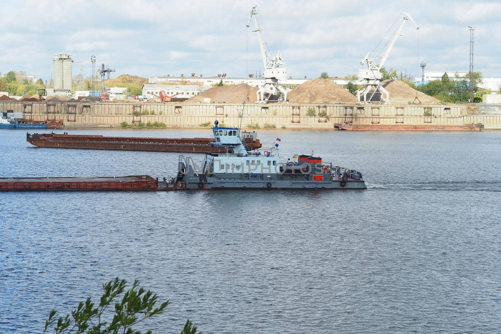 River. Seaport Production on water. Sand mining and shipping.