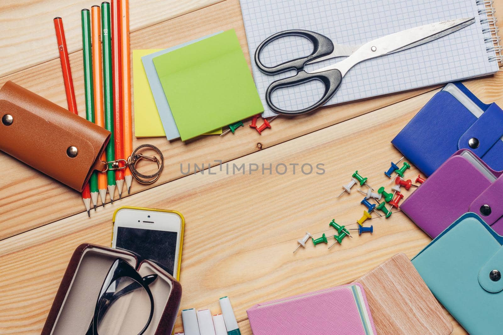 holders multicolored markers work desk stationery top view. High quality photo