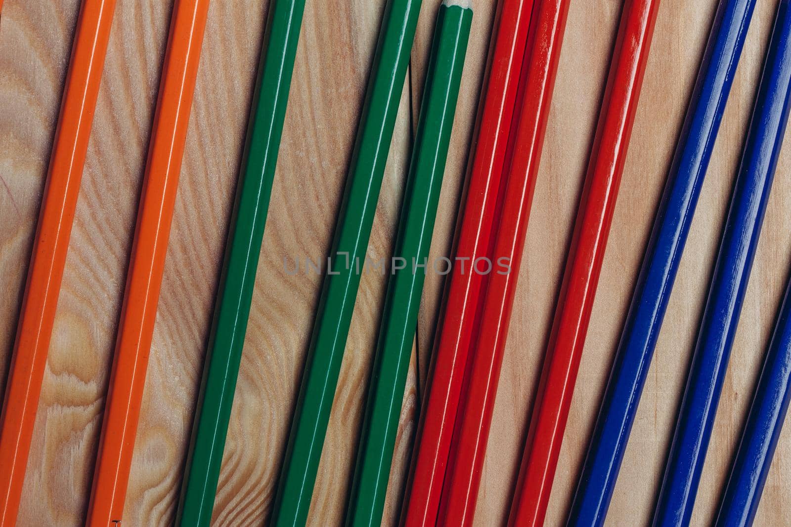 multicolored pencils object on work table wooden background office close-up. High quality photo