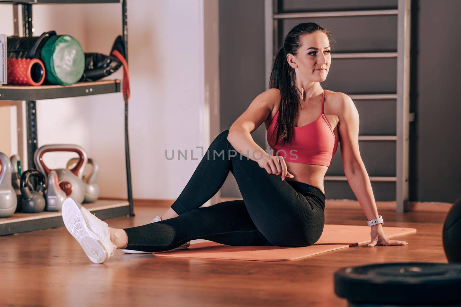 stretching the body before exercise in the fitness studio.