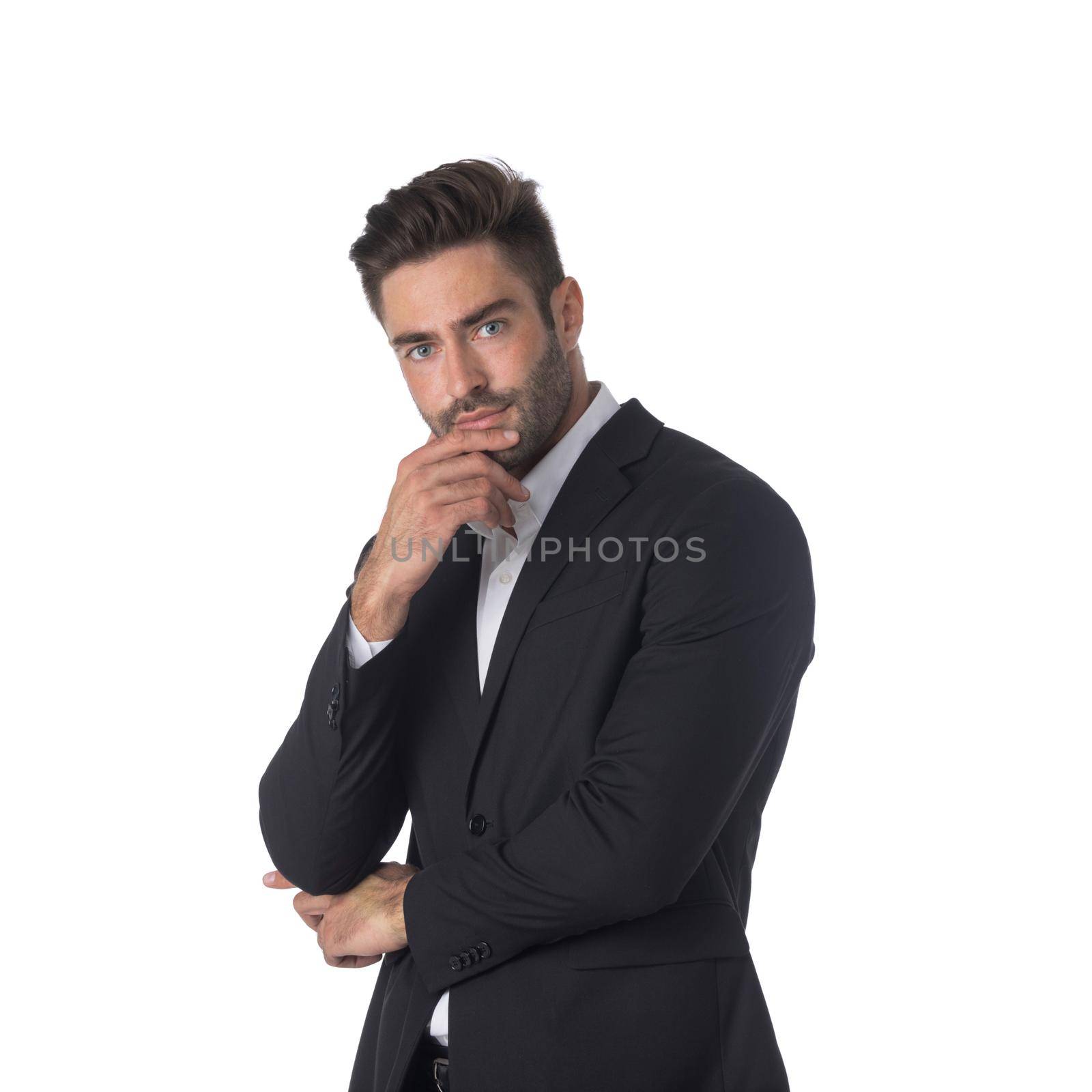 Portrait of young handsome business man in black suit thinking holding hand on chin studio isolated on white background