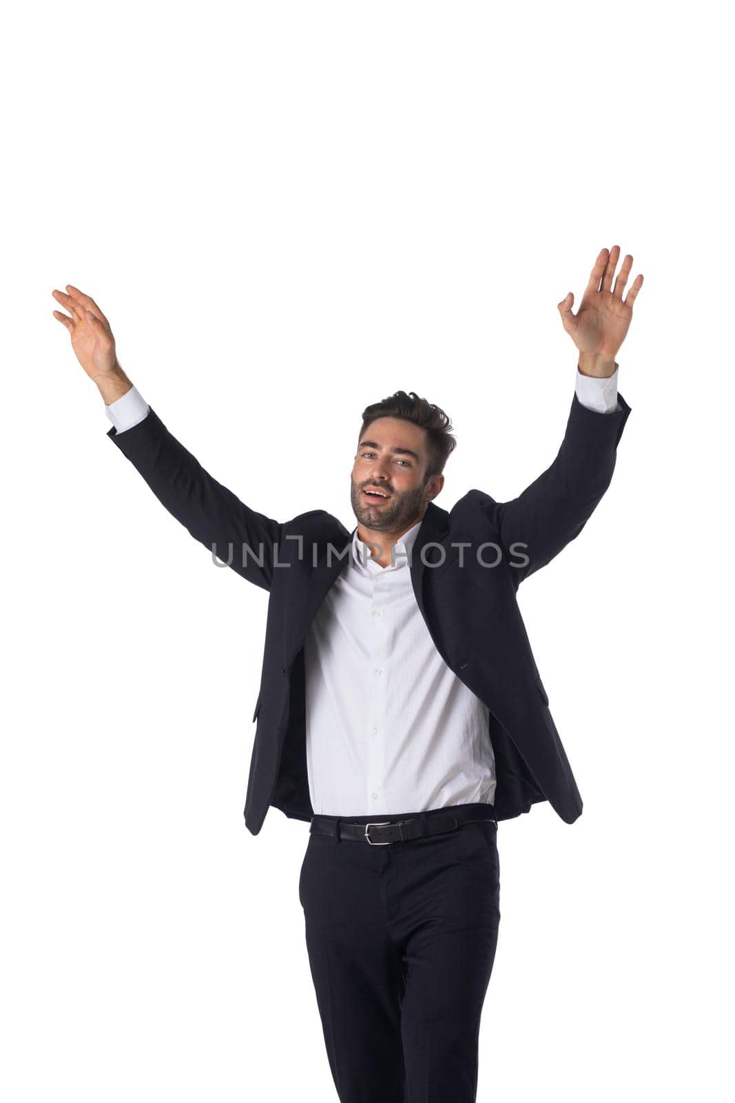 Portrait of young handsome business man in black suit with raised arms up studio isolated on white background