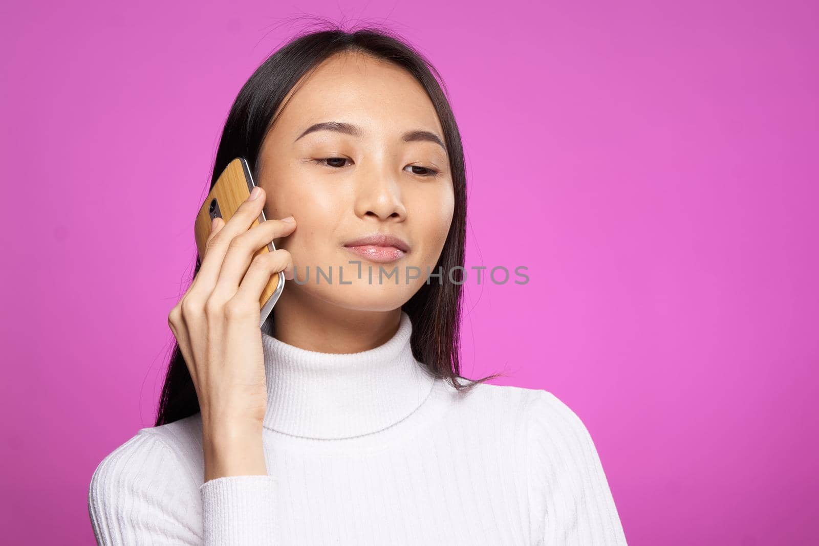 cute asian woman talking on the phone internet communication technology. High quality photo